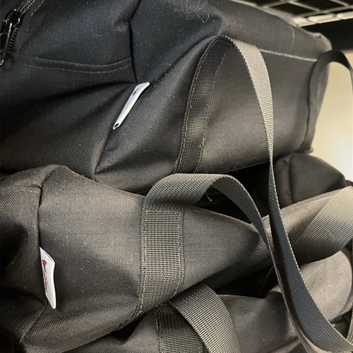 Close up of duffel bags made with Berry Compliant fabric