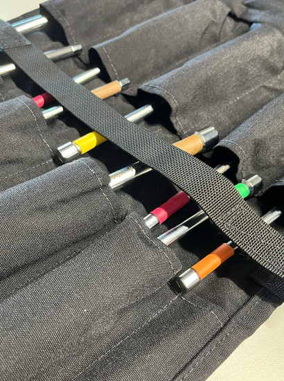 Berry Compliant Tool Roll open to view assorted tools